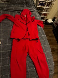 Red Nike tech jump suit