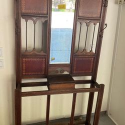 Antique wood hall cabinet with mirror, coat hooks, umbrella area and cubby for gloves