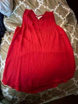 orange and blue sleeveless blouses with a relaxed, flowy silhouette.