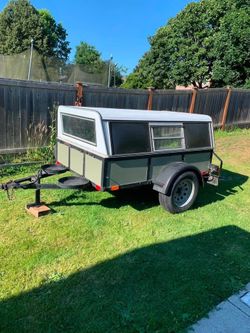 Covered camping/utility trailer.