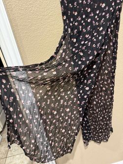 Black sheer scarf/ wrap with pink floral pattern.