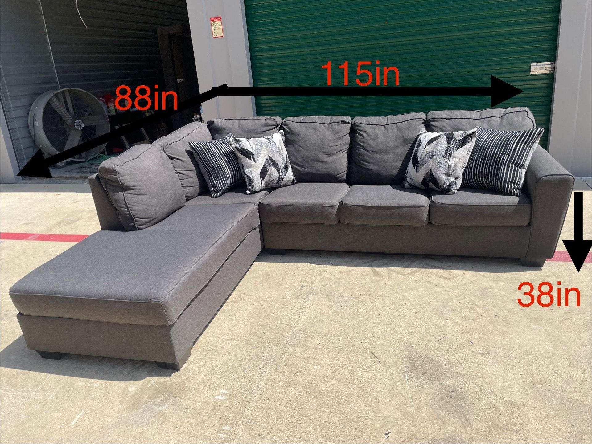 Gray 2pc Sectional W/Pillows By Living Spaces (DELIVERY AVAILABLE)