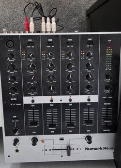 1                  This is a Behringer DJX700 5-channel professional DJ mixer, which features digital effects and a BPM counter.