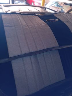 1957 to 1959 maybe others front seat covers bench style black and gray with Chevy emblem on back top cover nice and brand new front carpet brown trim