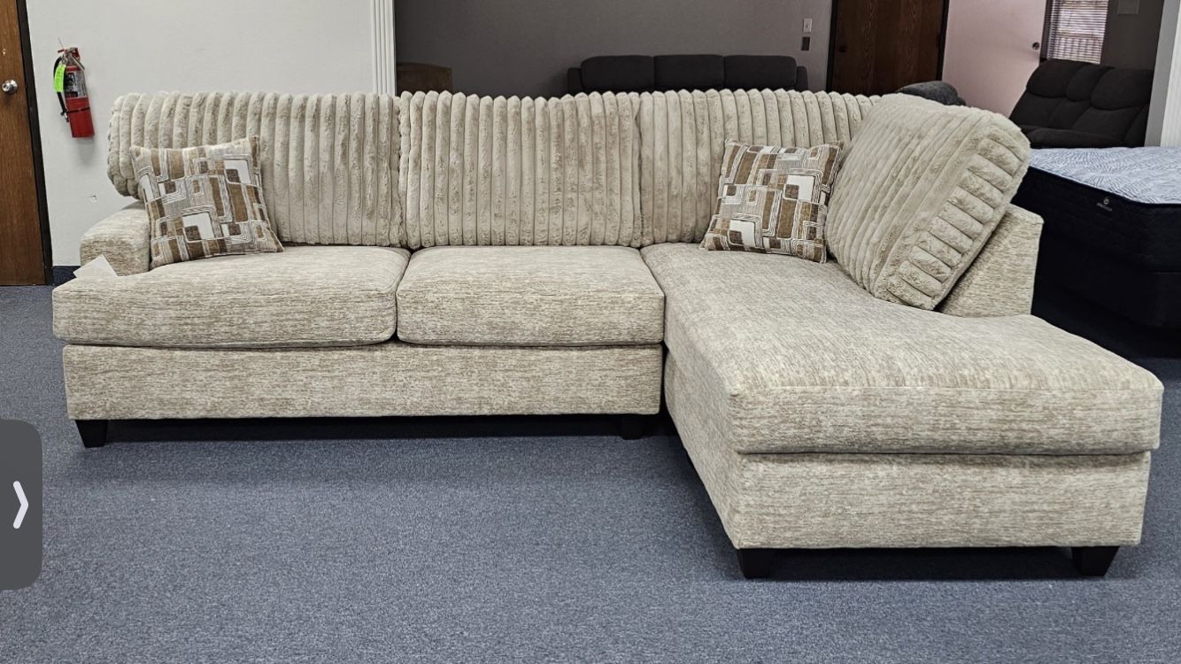 Parchment Sectional With Channel Tufted Cushions