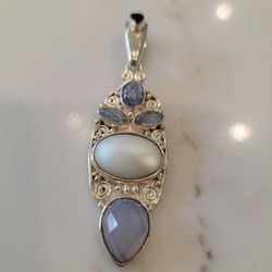 Sterling silver pendant with genuine stones.