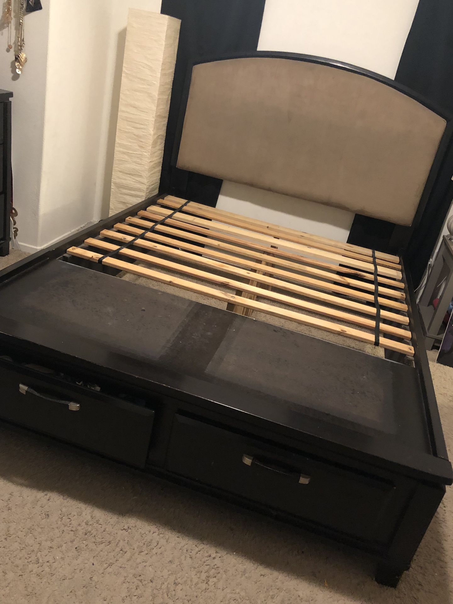 Padded Queen Bed Frame with two drawers. Few dents/scratches.