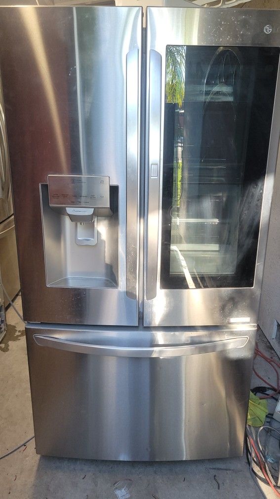 LG REFRIGERATOR WITH NEW COMPRESSOR INSTALLED WORKS GREAT CAN DELIVER