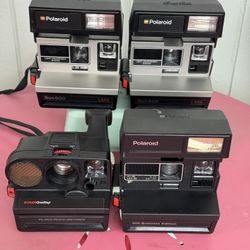 Four Polaroid Cameras