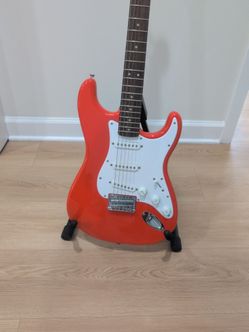 Red Stratocaster-Style Electric Guitar with bag and stand