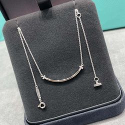 Tiffany smiley face necklace with diamonds on both sides