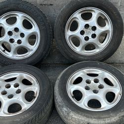 Oldsmobile 16 inch rims and center caps. 5 on 115mm-