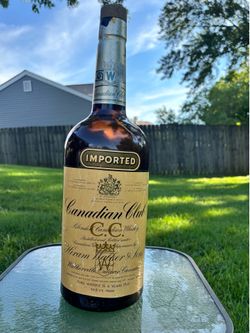 Old vintage Canadian club bottle / change holder