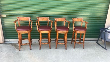 4 barstools with burgundy leather seats