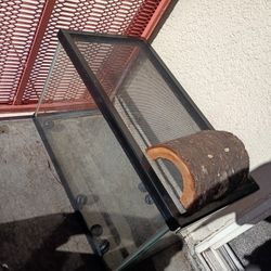 Reptile Tank And Heating Rock, 2 Heating Lamps, Feeding Bowls, Balls For Slow Feed, And Climbing Wood One Is A 40 Gallon, One Is 10 Gallon