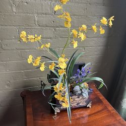 Yellow silk flowers In ornate box