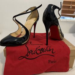 Christian Louboutin Black and Gold Pumps