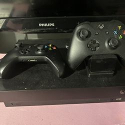 Xbox  one X with 2 controllers and games