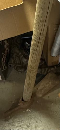 a long-handled wooden tool, pick axe you'll need your own handle this one is to big and it comes out