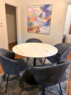 Dining table and 4 chairs. Like new. Rug additional cost.