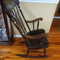 ROCKING CHAIR - SOLID WOOD...The Arms of Chair Could Use a Little Tighting, Other Wise in Great Condition..