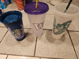 Three  Starbucks reusable cups