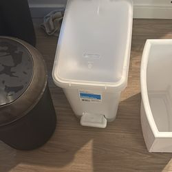 Three trash cans