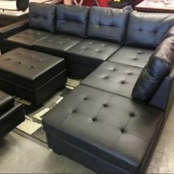 Heights Black Faux Leather Reversible Sectional with Storage Ottoman 