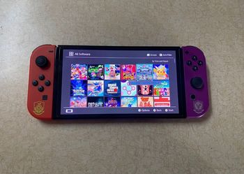 Nintendo Switch OLED with 125 SWITCH GAMES