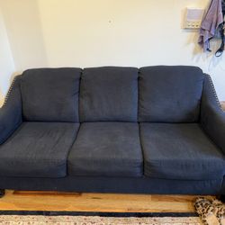 Selling a 3 seat blue couch, comfortable gray armchair, and a matching ottoman. It's a great set for relaxing and adding a touch of style to your livi