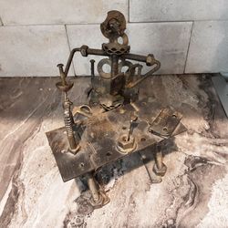 Vintage Folk Art Nuts & Bolts Sculpture Don Quixote at his desk 6 1/2" x 5 1/2"