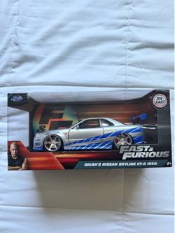 Brand new Fast & Furious Brian's Nissan Skyline GT-R (R34) die-cast model by Jada Toys. Still sealed in original packaging and in excellent condition.