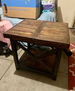 Brown End table with Metal Frame and Exposed Bolt Heads