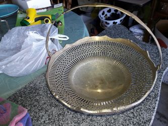 Round silver fruits basket.