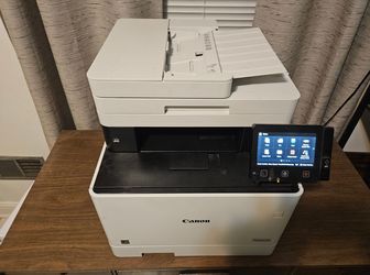 Canon Wireless Laser All-In-One Color Printer with unused black toner cartridge