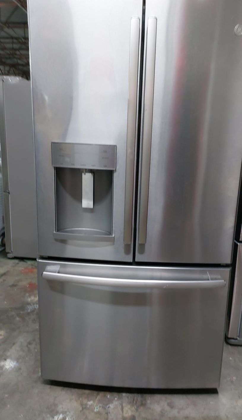 Stainless GE Fridge with LED Lighting and Water Dispenser