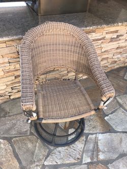 Wicker and metal swivel chair for outdoor