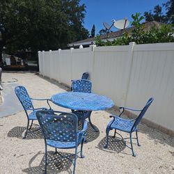 Table and five chairs cast aluminum