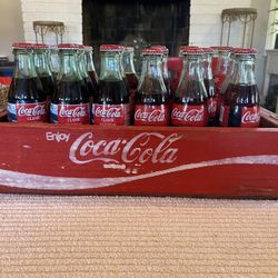 Vintage wooden Coca Cola case with glass bottles