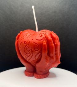 Heart in hands candle