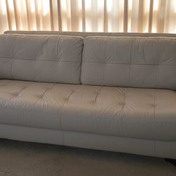 Cream colored leather sofa