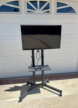LG 32” Smart TV + Heavy Duty Rolling TV Stand / Cart