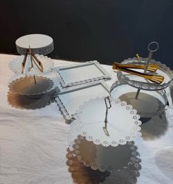 11-piece elegant white metal cake stand and dessert display set.