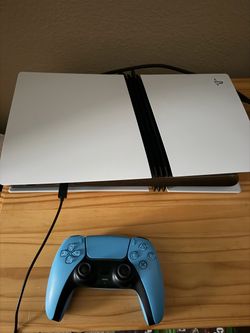 PlayStation 5 Pro With Blue Controller And Packaging