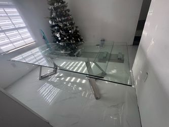 Glass and steel dinning table from el dorado
