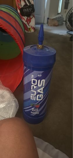 The image shows a Euro Gas N₂O (nitrous oxide) canister (labeled with "BLUE RAZZ" and "2000g"), which is a pressurized gas cylinder commonly marketed 