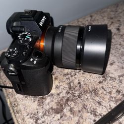 A7ii Sony With A 50mm Prime Lens And Externas NP BATTTERY ADAPRTER 