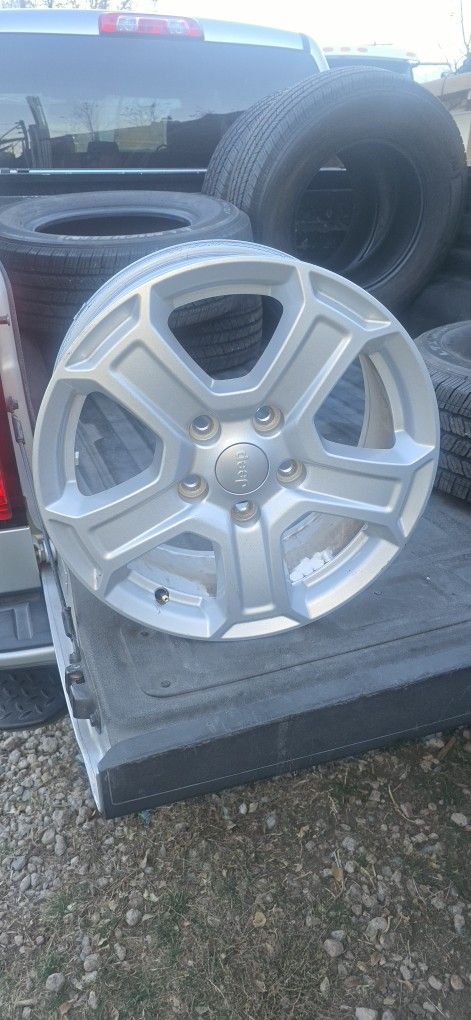 4 Jeep Rims, Along With 5 Tires
