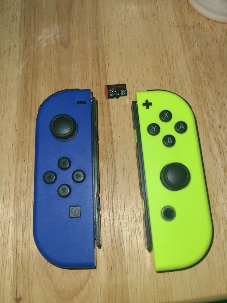 Nintendo switch joy cons and 32 gb memory card.