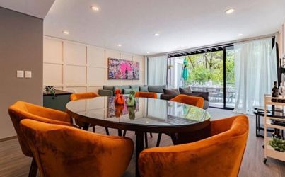 Round Dining Table with 6 Orange Velvet Chairs